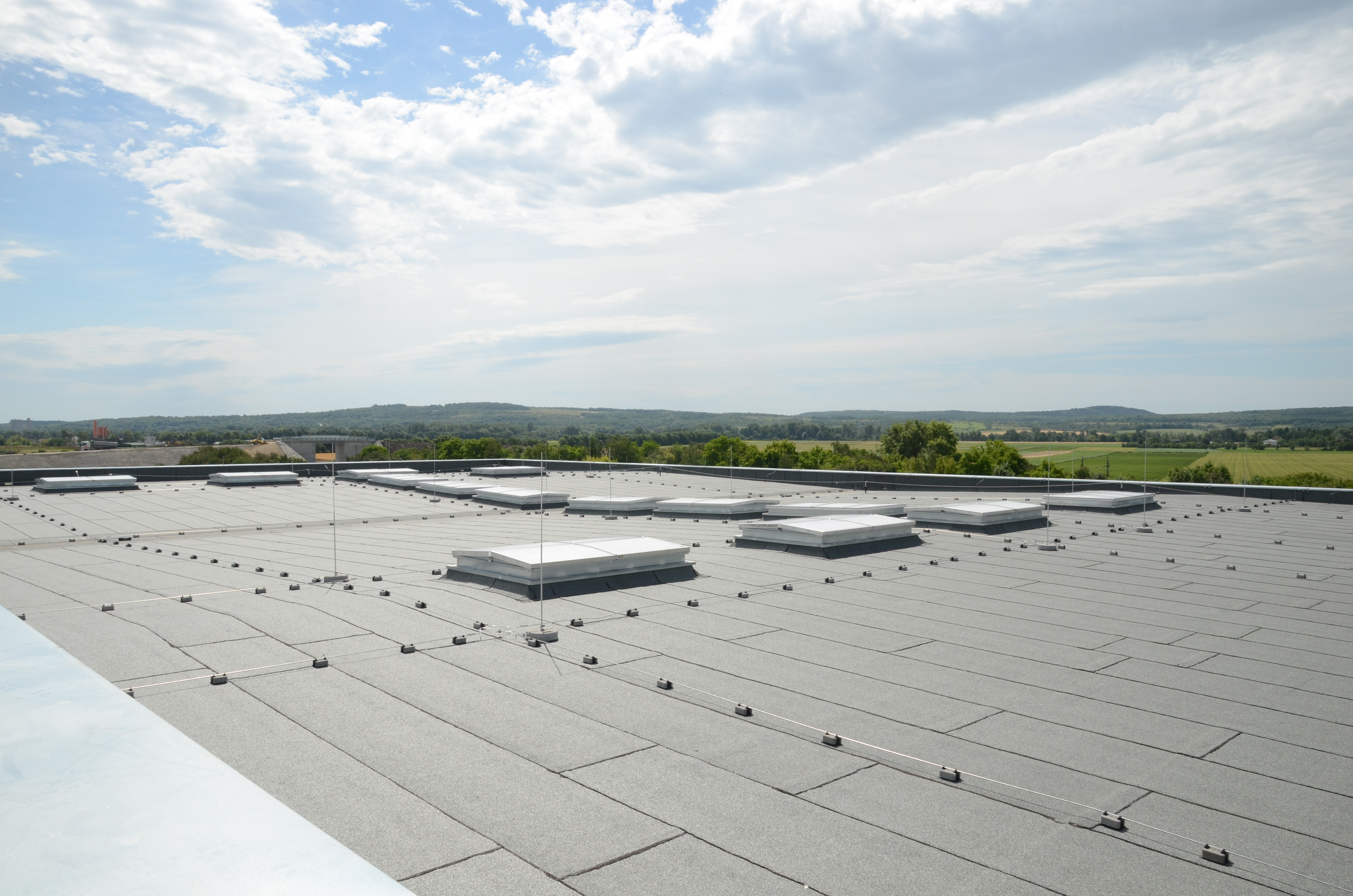 Create cost effective falls on a flat roof